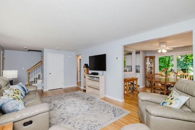 44 Spruce Tree Ln Unit 44, Norton, MA 02766 - living area with stairway, light wood-style flooring, and ceiling fan