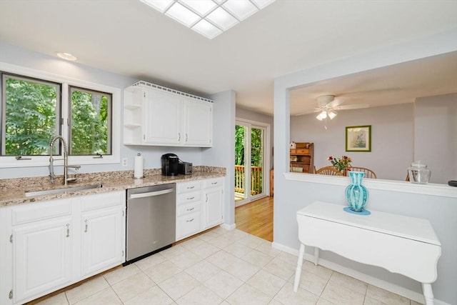 44 Spruce Tree Ln Unit 44, Norton, MA 02766 - kitchen with stainless steel dishwasher, white cabinets, light stone counters, and open shelves