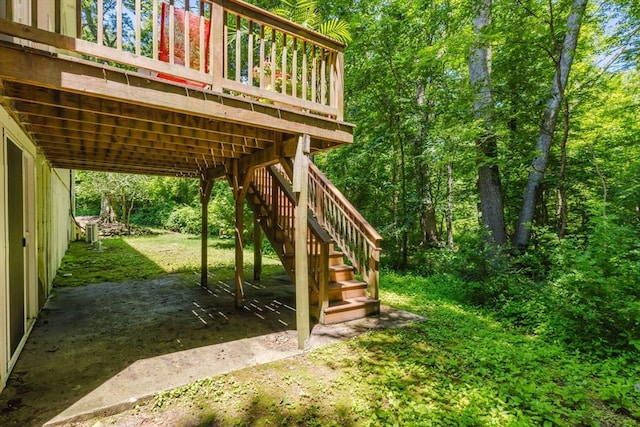 44 Spruce Tree Ln Unit 44, Norton, MA 02766 - view of yard with stairs, a deck, and a view of trees