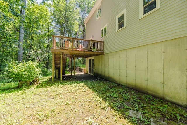 44 Spruce Tree Ln Unit 44, Norton, MA 02766 - view of yard featuring a wooden deck and a carport
