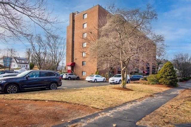 289 Elm St Unit 34B, Medford, MA 02155 - view of building exterior with uncovered parking