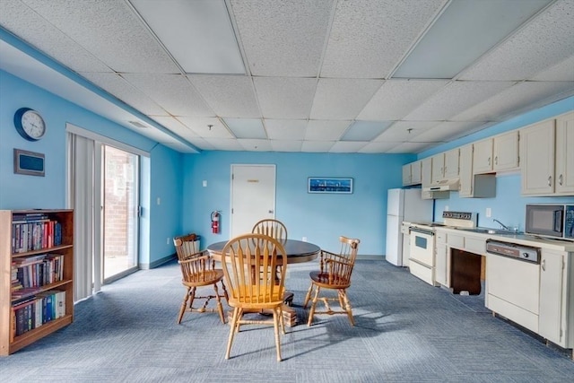 289 Elm St Unit 34B, Medford, MA 02155 - dining area featuring dark carpet and a drop ceiling