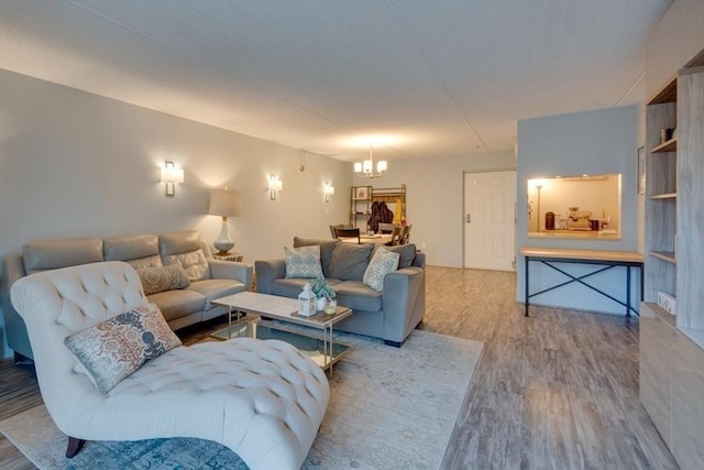 289 Elm St Unit 34B, Medford, MA 02155 - living area featuring wood finished floors and a chandelier