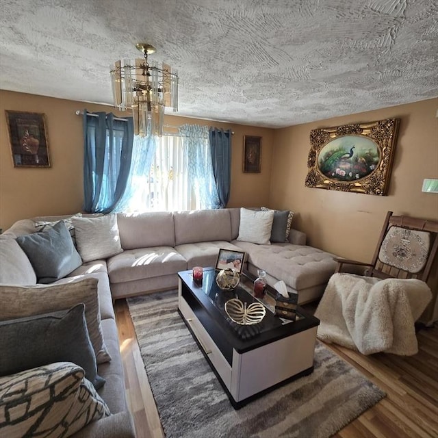 living room with a textured ceiling and wood finished floors