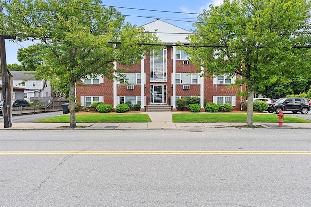 924 Main St Unit 14, Woburn, MA 01801 - townhome / multi-family property featuring brick siding and a front lawn