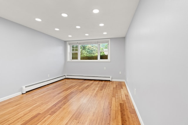 924 Main St Unit 14, Woburn, MA 01801 - unfurnished room with a baseboard radiator, recessed lighting, light wood-type flooring, and baseboards