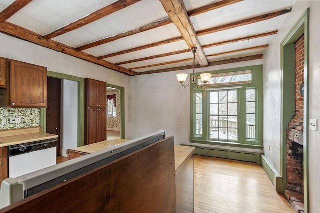 kitchen featuring pendant lighting, a baseboard heating unit, white dishwasher, beamed ceiling, and light wood-type flooring