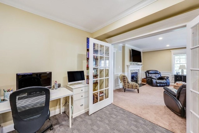 office area with light colored carpet and ornamental molding