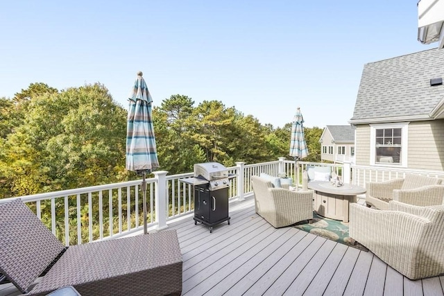 wooden terrace featuring area for grilling