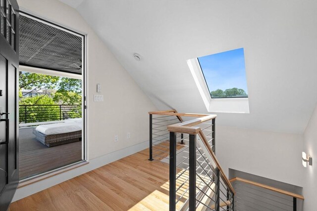 142 Amory St Unit 2, Cambridge, MA 02139 - additional living space with a skylight, wood finished floors, and lofted ceiling