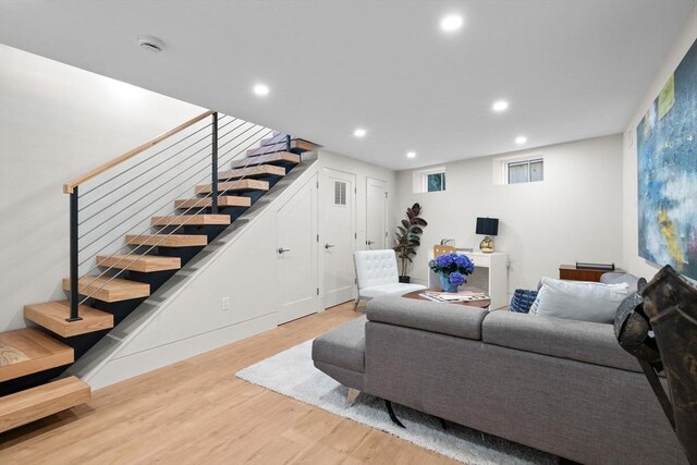 142 Amory St Unit 2, Cambridge, MA 02139 - living area with stairs, wood finished floors, and recessed lighting