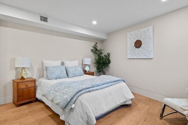142 Amory St Unit 2, Cambridge, MA 02139 - bedroom with light wood-style floors and recessed lighting