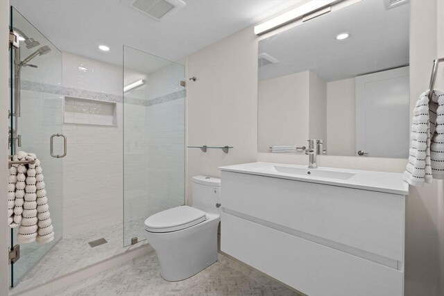 142 Amory St Unit 2, Cambridge, MA 02139 - full bath featuring toilet, a stall shower, recessed lighting, and vanity
