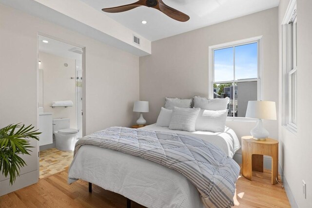 142 Amory St Unit 2, Cambridge, MA 02139 - bedroom with wood finished floors, recessed lighting, connected bathroom, baseboards, and a ceiling fan