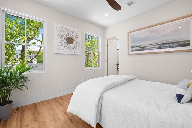 142 Amory St Unit 2, Cambridge, MA 02139 - bedroom with wood finished floors, a ceiling fan, visible vents, baseboards, and recessed lighting