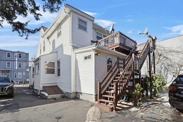 view of property exterior featuring a deck