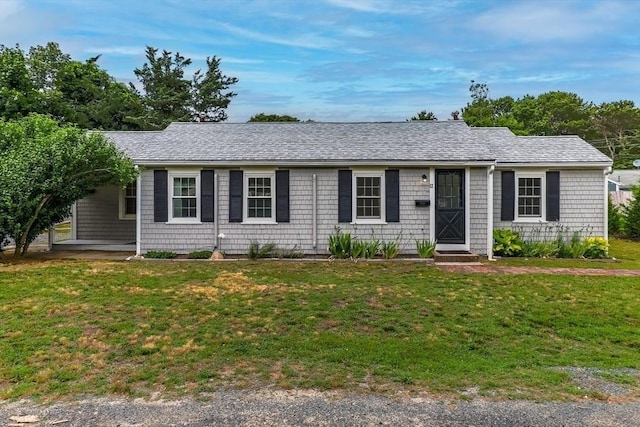 ranch-style house featuring a front yard