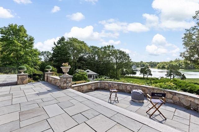 view of patio featuring a water view