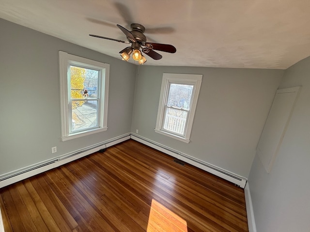 empty room with ceiling fan, a baseboard radiator, and hardwood / wood-style flooring