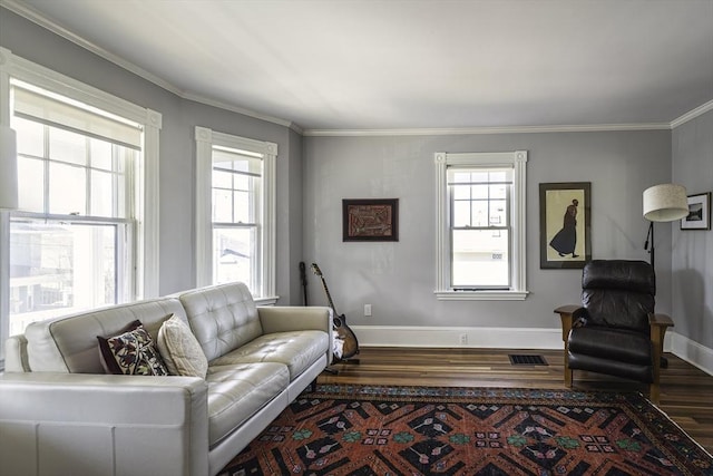 living room with baseboards, dark wood-style flooring, and a healthy amount of sunlight