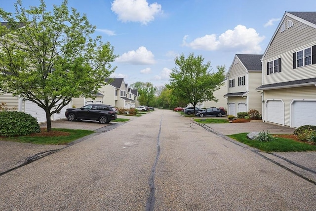 view of asphalt street with a residential view