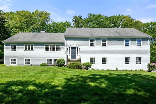 64 Bakers Hill Rd, Weston, MA 02493 - tri-level home featuring a front yard and a chimney