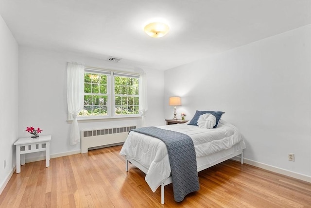 64 Bakers Hill Rd, Weston, MA 02493 - bedroom featuring radiator heating unit, light wood-style floors, and baseboards
