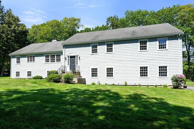 64 Bakers Hill Rd, Weston, MA 02493 - rear view of house featuring a lawn and a chimney