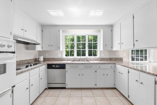 64 Bakers Hill Rd, Weston, MA 02493 - kitchen with dishwasher, under cabinet range hood, white oven, decorative backsplash, and electric stovetop
