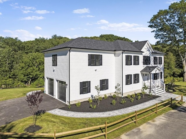 320 Old Westport Rd, Dartmouth, MA 02747 - view of property exterior featuring driveway, an attached garage, and a lawn