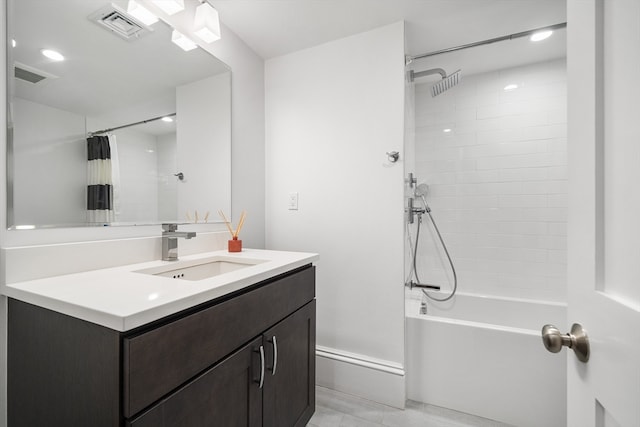 bathroom featuring vanity and shower / bath combination with curtain