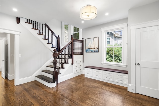 staircase featuring hardwood / wood-style flooring