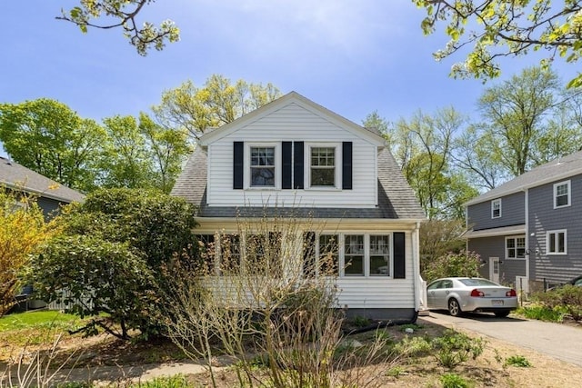 view of front of house featuring roof with shingles