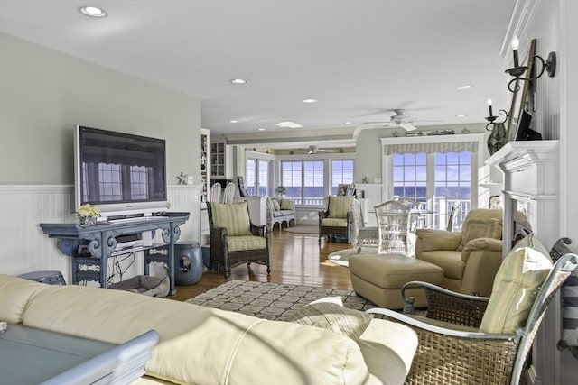 living room featuring ceiling fan and wood-type flooring