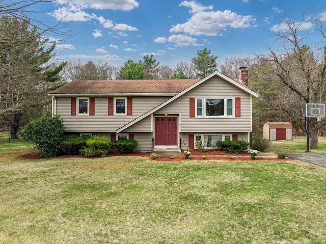 13 Independence Ln, Millis, MA 02054 - raised ranch with a storage shed, an outbuilding, a front lawn, and a chimney
