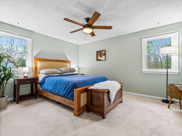 13 Independence Ln, Millis, MA 02054 - bedroom with light colored carpet, a textured ceiling, a ceiling fan, and baseboards