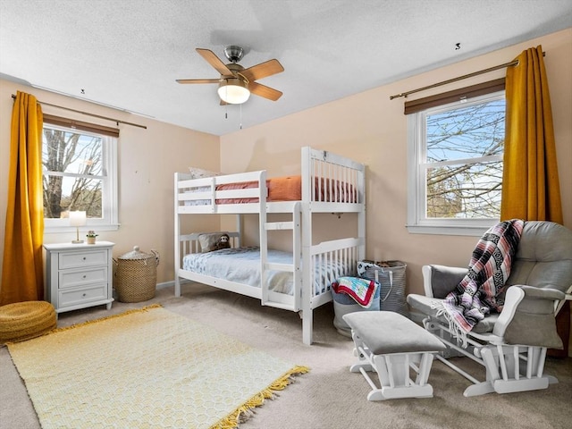 13 Independence Ln, Millis, MA 02054 - carpeted bedroom featuring multiple windows and a ceiling fan