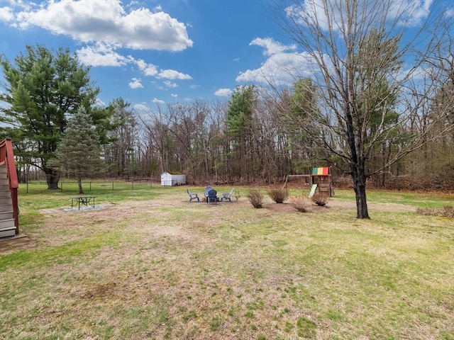 13 Independence Ln, Millis, MA 02054 - view of green lawn with a storage unit and an outbuilding