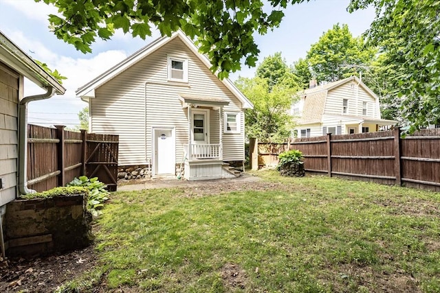 108 Arlington Rd, Woburn, MA 01801 - rear view of house with a fenced backyard