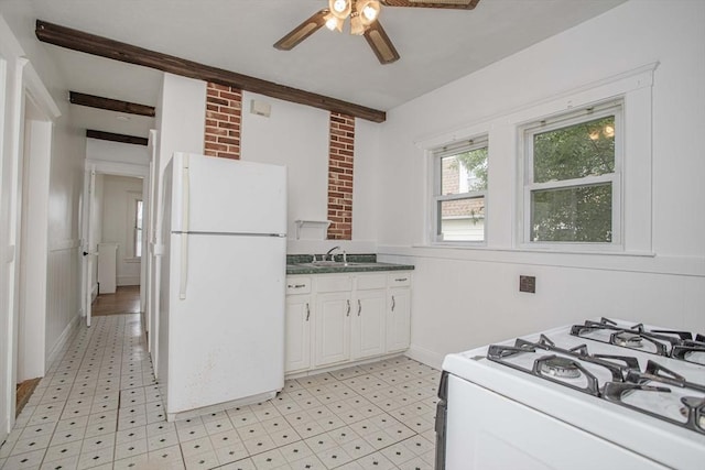108 Arlington Rd, Woburn, MA 01801 - kitchen with white appliances, light floors, a ceiling fan, white cabinetry, and a wainscoted wall