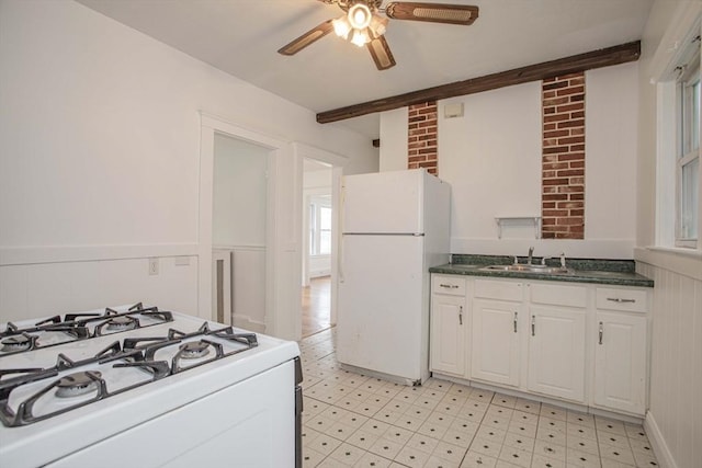 108 Arlington Rd, Woburn, MA 01801 - kitchen featuring white appliances, ceiling fan, dark countertops, light floors, and white cabinetry
