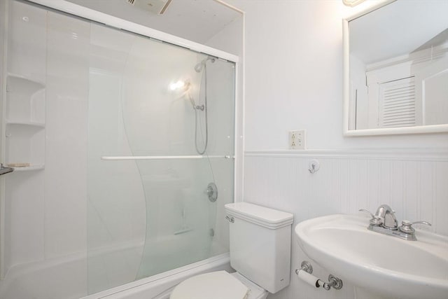108 Arlington Rd, Woburn, MA 01801 - full bath featuring wainscoting and bath / shower combo with glass door