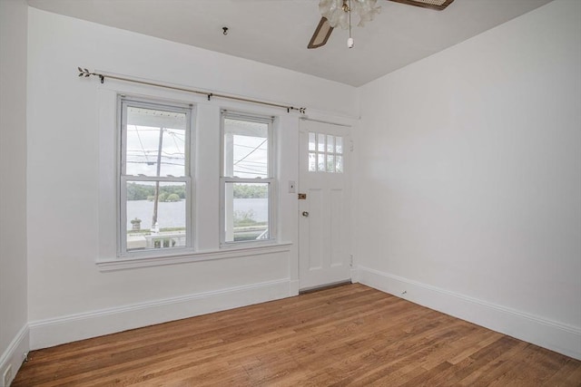 108 Arlington Rd, Woburn, MA 01801 - foyer with light wood finished floors, ceiling fan, and a water view