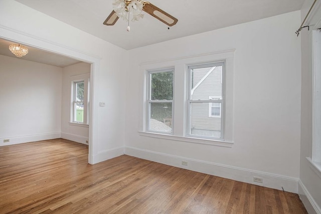 108 Arlington Rd, Woburn, MA 01801 - empty room with light wood finished floors and a ceiling fan