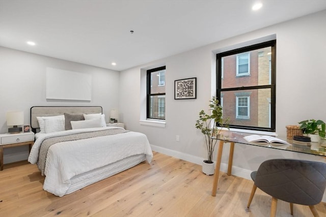 bedroom with light wood-type flooring