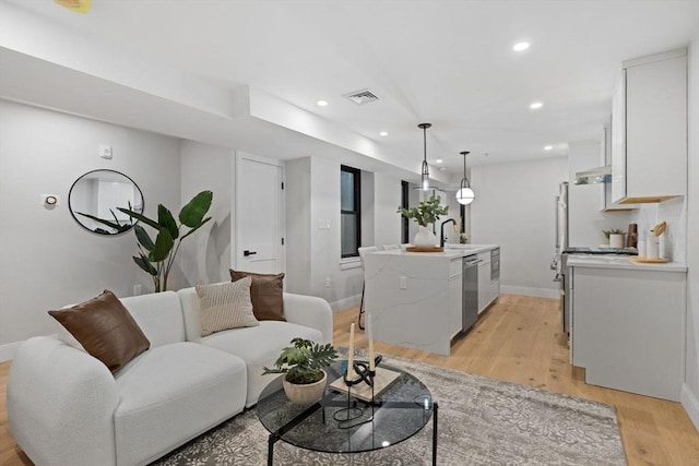 living room with light hardwood / wood-style flooring