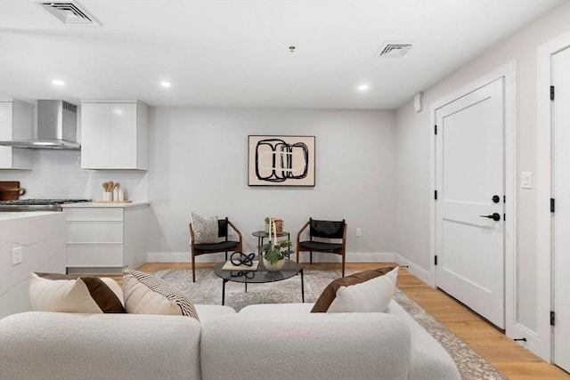 living room with light hardwood / wood-style flooring