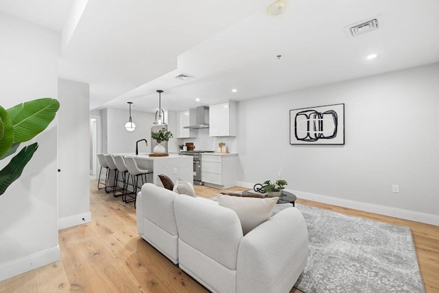 living room with light hardwood / wood-style flooring