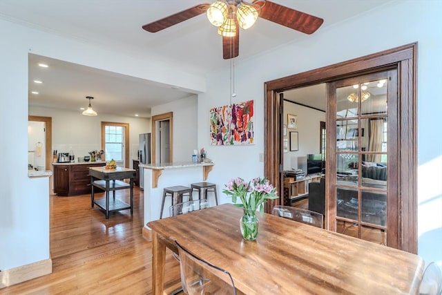 dining space with recessed lighting, a ceiling fan, and light wood-type flooring