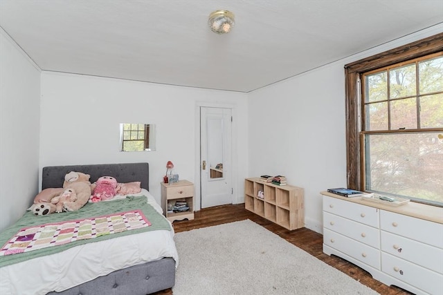 bedroom with wood finished floors